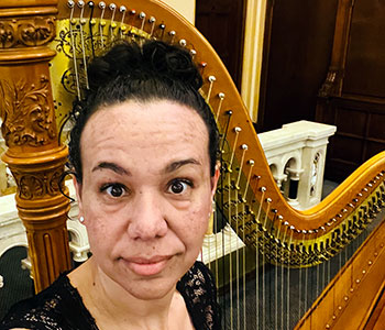 Photo of Aja with her harp