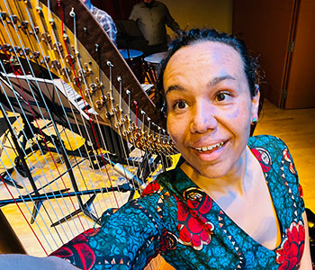 Photo of Aja with her harp